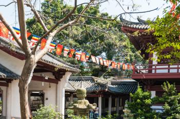 GUANGZHOU, CHINA - APRIL 1, 2017: green garden in court of Guangxiao Temple (Bright Obedience, Bright Filial Piety Temple). This is is one of the oldest Buddhist temples in Guangzhou city