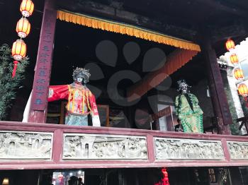 XINGPING, CHINA - MARCH 30, 2017: decoration of facade ancient opera stage in Xing Ping town in Yangshuo county. The town was settled in 265 AD, Xingping is surrounded by great examples of Karst peaks