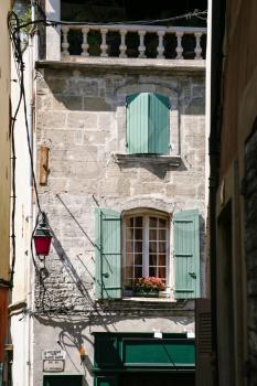 Travel to Provence, France - facade of old residential house in Arles city