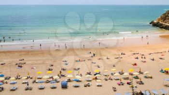 Travel to Algarve Portugal - above view of people on urban beach Praia do Peneco in Albufeira city