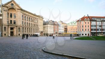 RIGA, LATVIA - SEPTEMBER 12, 2008: tourists on Doma Laukums (Doms) square in Old Riga Town in autumn. Riga city historical centre is a UNESCO World Heritage Site