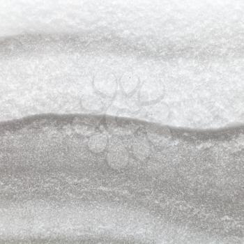 texture of the snowdrift in cross section between two glasses