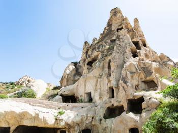 Travel to Turkey - ancient cave chapel in rock near Goreme town in Cappadocia in spring