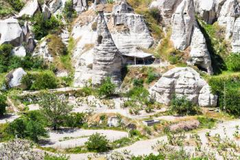 Travel to Turkey - rural landscape with ancient cave churches near Goreme town in Cappadocia in spring
