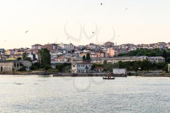 Travel to Turkey - view of waterfront in Istanbul city in spring evening from Golden Horn bay