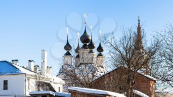 cityscape of Suzdal town with Church of Antipas, Bishop of Pergamon (Antipiev Church) and Church of Lazarus the Righteous Resurrection (Lazarevskaya Church) in winter in Vladimir oblast of Russia