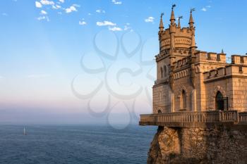 travel to Crimea - view of Swallow Nest Castle over Black Sea in Gaspra District on Crimean Southern Coast in sunset