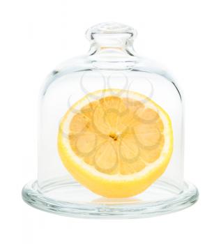 halved fresh lemon in Glass Lemon Keeper isolated on white background