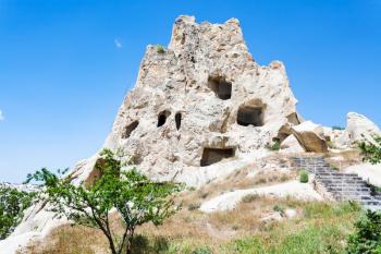 Travel to Turkey - ancient cave church in rock near Goreme town in Cappadocia in spring