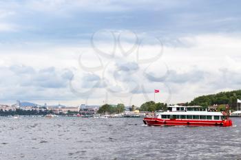 Travel to Turkey - excursion boat in Golden Horn bay in Istanbul city in spring