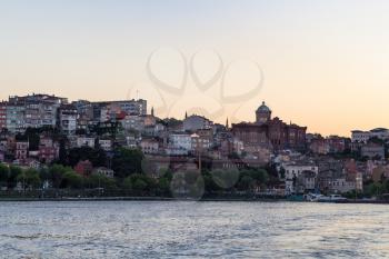 Travel to Turkey - waterfront in Fatih district in Istanbul city in spring evening from Golden Horn bay