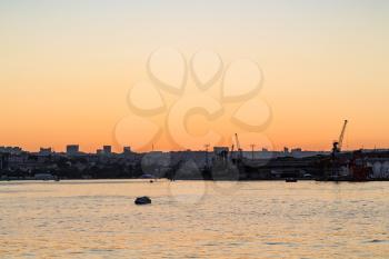 Travel to Turkey - landing stage on Golden Horn bay in Istanbul city in spring sunset