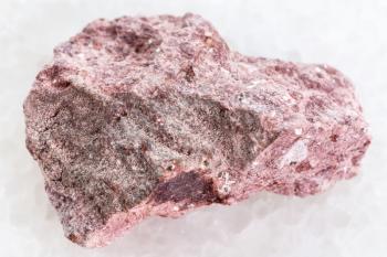 macro shooting of natural mineral rock specimen - raw Ash Tuff stone on white marble background
