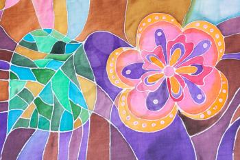 textile background - hand drawn stylized flower and leaf on silk batik scarf