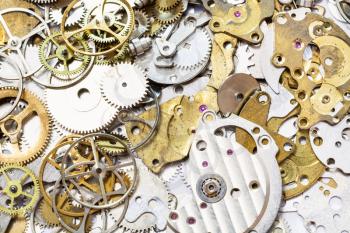 watchmaker workshop - background from many old watch spare parts