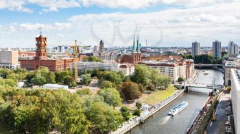 travel to Germany - above view of Spree River with Rathausbrucke near Rotes Rathaus (Red City Hall) and Nikolaikirche (St Nicholas Church) in Berlin city in september