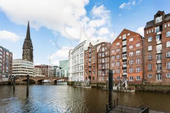 Travel to Germany - view of houses on waterfront of Nikolaifleet canal near Deichstrasse in Hamburg city downtown in september