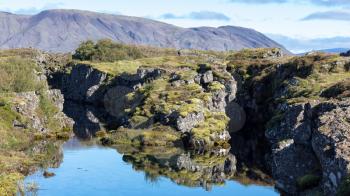 travel to Iceland - view of Silfra fault in valley of Thingvellir national park in september