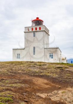 travel to Iceland - view of Dyrholaeyjarvit lighthouse on Dyrholaey peninsula, near Vik I Myrdal village on Atlantic South Coast in Katla Geopark in september