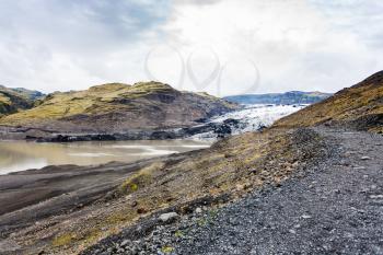travel to Iceland - footpath to Solheimajokull glacier (South glacial tongue of Myrdalsjokull ice cap) in Katla Geopark on Icelandic Atlantic South Coast in september