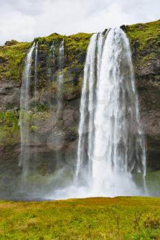 travel to Iceland - Seljalandsfoss waterfall of Seljalands River in Katla Geopark on Icelandic Atlantic South Coast in september