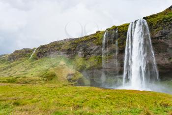 travel to Iceland - view of Seljalandsfoss waterfall of Seljalands River in Katla Geopark on Icelandic Atlantic South Coast in autumn