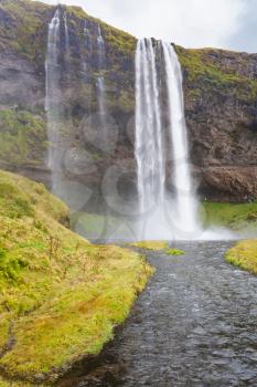 travel to Iceland - Seljalands River and Seljalandsfoss waterfall in Katla Geopark on Icelandic Atlantic South Coast in september