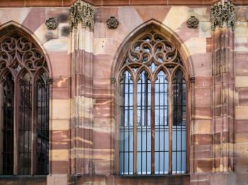trave to France - outdoor windows of Strasbourg Cathedral from of square Place du Chateau in summer evening