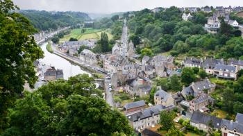 travel to France - view of Dinan town and Rance river from belvedere at Promenade de la Duchesse Anne of the Jardin Anglais (English garden) in rain