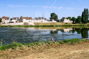 Travel to France - view of houses on Quai Francois Tissard on island Ile d'Or in Amboise town at riverbank of Loire river in Val de Loire region in sunny summer day