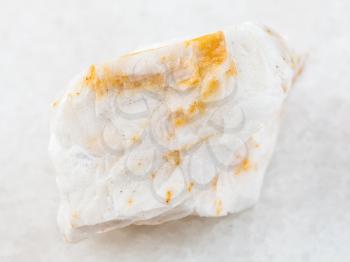 macro shooting of natural mineral rock specimen - raw Baryte ore on white marble background from Belorechenskoye mine, Adygea, Russia