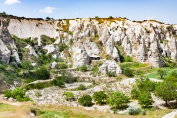 Travel to Turkey - rural scenery with ancient cave churches near Goreme town in Cappadocia in spring