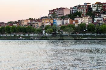 Travel to Turkey - quay in Fatih district in Istanbul city in spring evening from Golden Horn bay