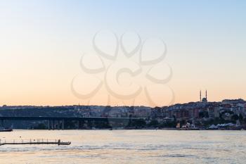Travel to Turkey - view of Halic Bridge (Golden Horn Bridge) in Istanbul city in spring evening