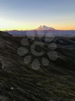 travel to North Caucasus region region - view of Mount Elbrus from Bermamyt mountain Plateau at dawn