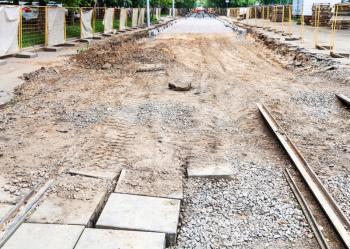 repair of tram tracks in Moscow city - broken old tram road and laying of new rails on the tram track