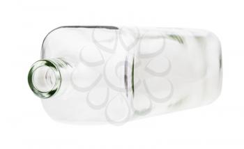 overturned empty clear whiskey bottle isolated on white background
