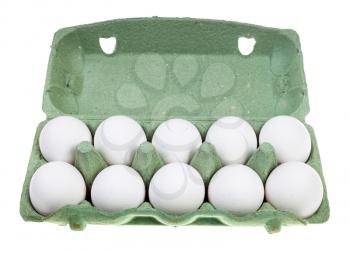 ten white chicken eggs in green cardboard container isolated on white background
