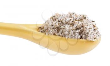 side view of ceramic spoon with seasoned salt with spices and dried herbs close up isolated on white background