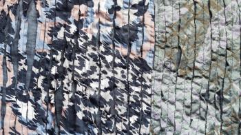 textile panoramic background - spotted ornament of scarf stitched from fabric with cuts