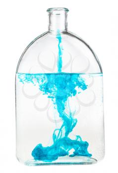 blue ink dissolves in water in bottle isolated on white background