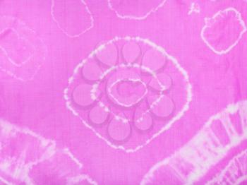 part of abstract pattern of pink scarf colored in tie-dye batik technique