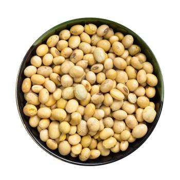 top view of raw dried soybeans in round bowl isolated on white background