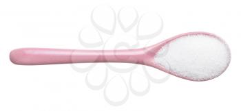 top view of sugar substitute - crystalline extract of stevia plant in pink ceramic spoon isolated on white background
