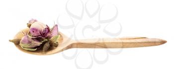 old dried rosebuds in wooden spoon isolated on white background