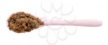 top view of dark muscovado cane sugar in ceramic spoon isolated on white background
