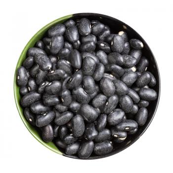 top view of raw black turtle beans in round bowl isolated on white background