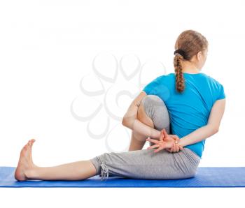 Yoga - young beautiful slender woman yoga instructor doing Forward Bends Sage Twist C pose (Marichyasana C) asana exercise isolated on white background