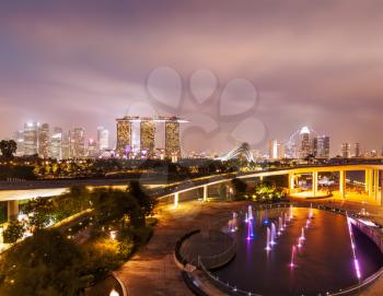 Tracel background of Singapore skyline illumintaed in the evening twilight