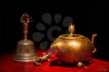 Tibetan Buddhist still life - vajra, bell, water vessel. Hemis gompa, Ladakh, India.
